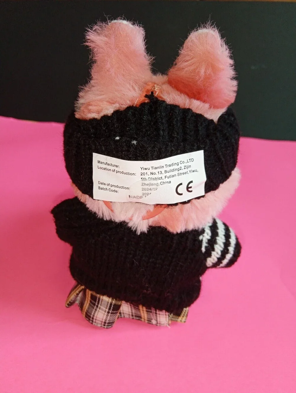Labibu Doll outfit. Wearing A Knit Striped Sweater, Plaid Skirt, And Headband.